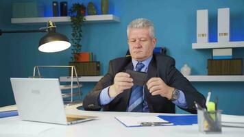 Businessman showing his empty wallet to the camera. video