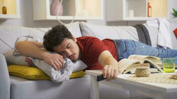 Lazy man falling asleep with tv remote in hand. video