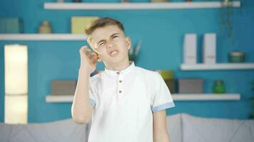 Boy scratching his ears. video