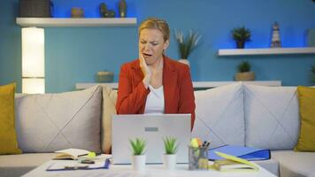 Home office worker woman teeth aches and pains. video