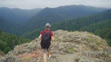 Man walking on cliffs. video