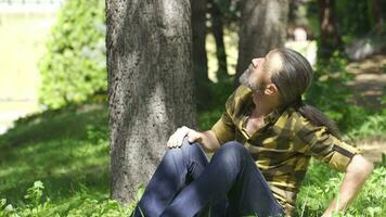 Schizophrenic and depressed man looking around in open field. video