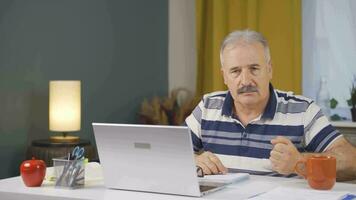 Home office worker man looking nervously at camera. video