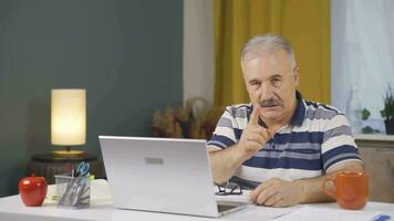 Home office worker man looking at camera with a stern angry warning. video