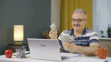 Home office worker man counting money funny and funny. video