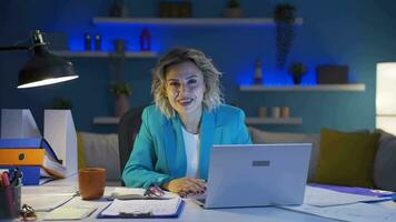 Home office worker woman says wow to camera. video