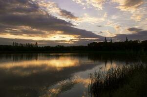 a lake with a church in the background photo