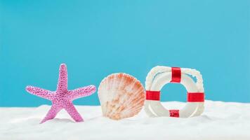 Starfish, seashell and lifebouy on white sand. Copyspace for text. Concept of summer photo