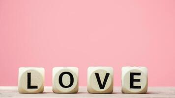 Love on wooden cubes for Valentine's day concept. photo