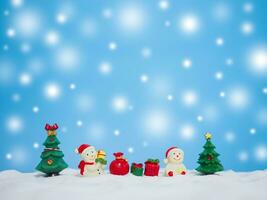 Snowman in the town with shiny light for Christmas and New Year holidays background, Winter season, falling snow, Copy space for Christmas and New Year holidays greeting card. photo