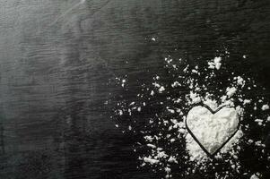 a heart shaped sugar on a black background photo