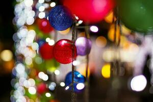 Closeup and crop decorate woven ball on Blurred and bokeh of Christmas holiday lighting and night time background. photo