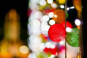 Crop and blurred image of Christmas decorate woven ball on night time background. photo