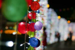 Crop and blurred image of Christmas decorate woven ball on night time background. photo