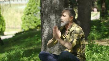 Man meditates, relaxes, calms down. video