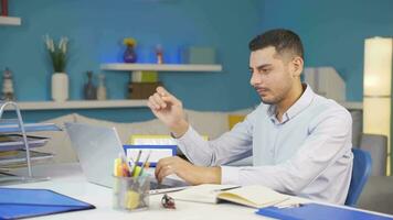 Home office worker man reading good news and feeling happy. video