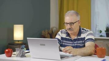 Home office worker man looking with satisfied expression. video