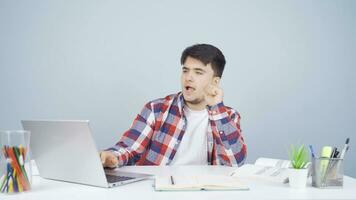 Man looking at laptop is happy and dancing. video