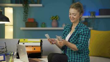 Home office worker woman counting money funny and funny. video