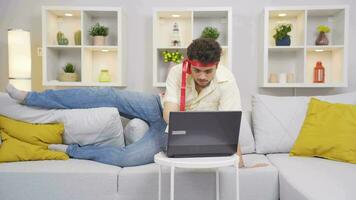 Man working on laptop with funny expression. video