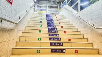 a stairway with many different colored signs on them photo