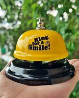 a group of colorful bells with the words ring for love on them photo