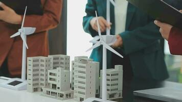 Business team people meeting and talking with engineer and architecture about planning and drawing of building construction project, smart executive professional working at outdoor, teamwork concept video