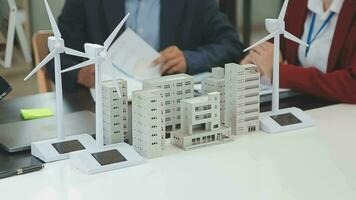 Business team people meeting and talking with engineer and architecture about planning and drawing of building construction project, smart executive professional working at outdoor, teamwork concept video