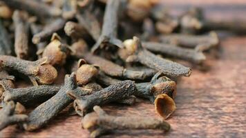 closeup of cloves spice on wooden table video