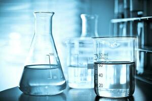 Laboratory glassware at lab background in blue tone photo