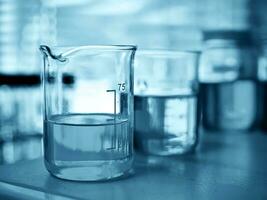 Laboratory glassware at lab background in blue tone photo