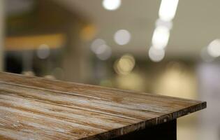 Empty wooden table in front of abstract blurred background of coffee shop . can be used for display or montage your products.Mock up for display of product photo