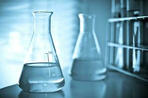 Laboratory glassware at lab background in blue tone photo