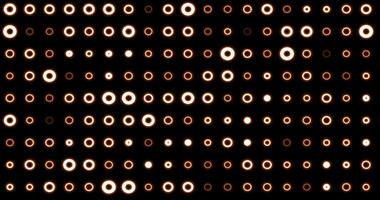 Abstract background of bright orange yellow glowing light bulbs from circles and dots of energy magic disco wall photo