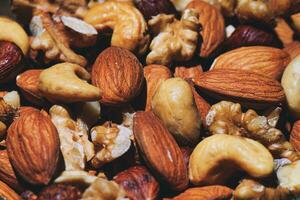 Some dried fruit almonds walnuts cashews and hazelnuts photo