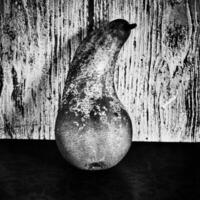 still life with pears on a wooden background photo