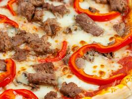 tasty pizza with meat and mushrooms photo
