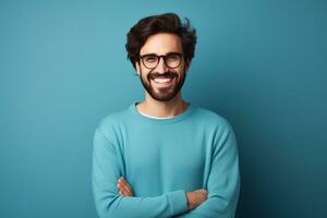 Young handsome man with beard wearing casual sweater and glasses over blue background happy face smiling with crossed arms ai generative photo