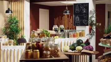 Panning shot of carbon neutral zero waste supermarket with fruits, vegetables, grains, spices and pasta on display. Empty environmentally friendly local neighborhood store video