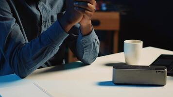 Close up shot of portable speaker used by content creator doing technology reviews for his online platforms channel. Influencer presents music playing device to his audience video