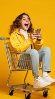 Excited happy girl using smartphone in shopping cart trolley on yellow background AI Generated photo