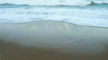 Agitated waves in the sea breaking on the beach video