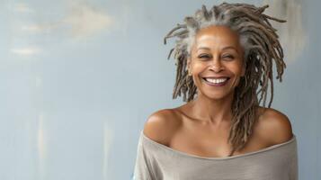 Happy mature african woman smiling cheerfully embracing her natural body with dreadlocks with copyspace AI Generated photo