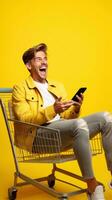Excited man laughing and using smartphone in shopping cart trolley on yellow background AI Generated photo