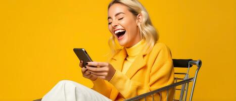 Excited woman laughing and using smartphone in shopping cart trolley on yellow background AI Generated photo