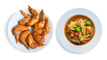 Fried chicken wings with papaya salad  Thai food in a plate PNG transparent