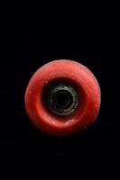 a red wheel with a hole in it photo