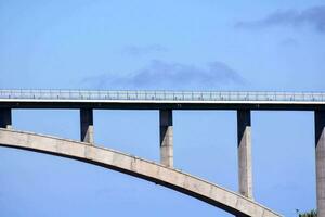 a bridge against a blue sky photo