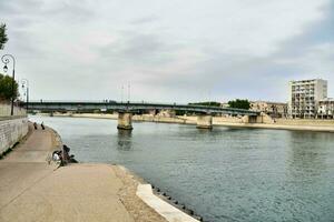 a river with a bridge photo