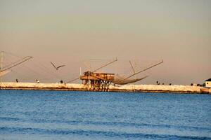 nets in the water near a pier photo